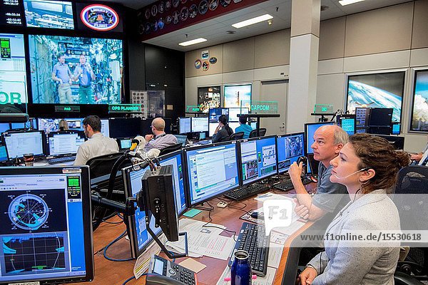 Flight Director Brian Smith Capcom Astronaut Jessica Meir along with Astronaut Jeff Williams monitor activities in Mission Control as President Donald Trump First Daughter Ivanka Trump and NASA astronaut Kate Rubins make a special Earth-to-space call from the Oval Office to personally congratulate NASA astronaut Peggy Whitson for her record-breaking stay aboard the International Space Station. (Photo Credit: NASARobert Markowitz)