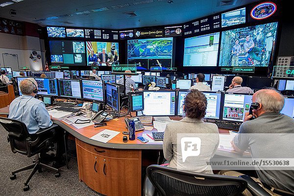 Flight Director Brian Smith Capcom Astronaut Jessica Meir along with Astronaut Jeff Williams monitor activities in Mission Control as President Donald Trump First Daughter Ivanka Trump and NASA astronaut Kate Rubins make a special Earth-to-space call from the Oval Office to personally congratulate NASA astronaut Peggy Whitson for her record-breaking stay aboard the International Space Station. (Photo Credit: NASARobert Markowitz)