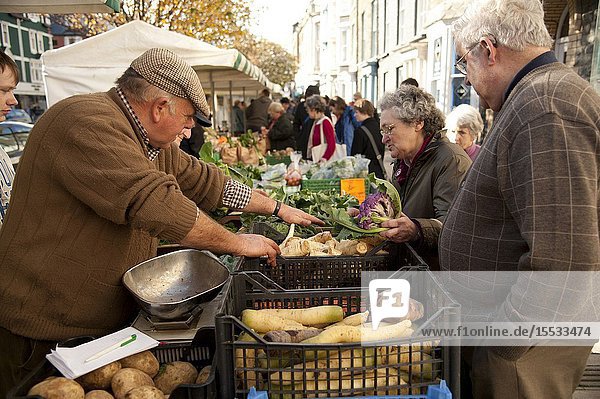 A woman buying fresh locally grown vegetables at Aberystwyth Farmers Market November 6 2010
