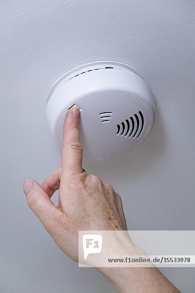 Smoke alarm being tested
