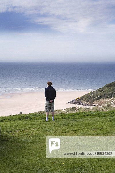 Man standing alone on a cliff top