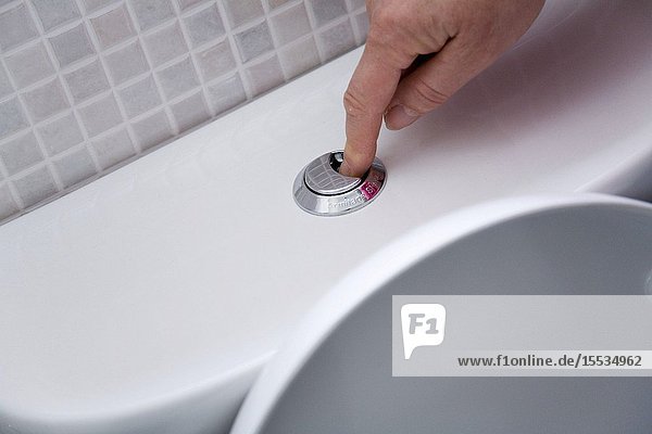 Dual Toilet being flushed