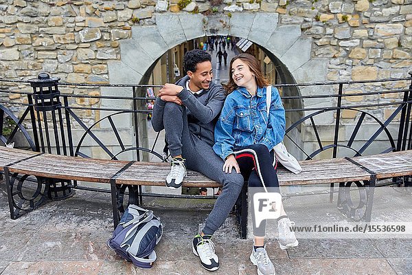 Couple of tourists visiting the city Multiracial young couple Donostia San Sebastian Gipuzkoa Basque Country Spain