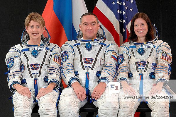 Attired in Russian Sokol launch and entry suits backup spaceflight participant Barbara Barrett (left) Russian cosmonaut Alexander Skvortsov backup Soyuz commander and Expedition 21 flight engineer and NASA astronaut Shannon Walker backup Expedition 21 commander and flight engineer take a break from training in Star City Russia to pose for a portrait. Photo credit: Gagarin Cosmonaut Training Center