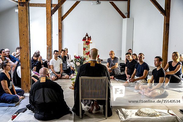 Zen sesshin (retreat) in Paris France. Master giving a lecture.