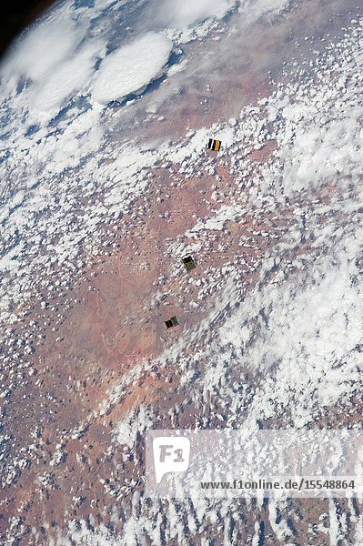 Three nanosatellites known as Cubesats are featured in this image photographed by an Expedition 38 crew member on the International Space Station. The satellites were released outside the Kibo laboratory using a Small Satellite Orbital Deployer attached to the Japanese module's robotic arm on Nov. 19 2013. Japan Aerospace Exploration Agency astronaut Koichi Wakata flight engineer monitored the satellite deployment while operating the Japanese robotic arm from inside Kibo. The Cubesats were delivered to the International Space Station Aug. 9 aboard Japan's fourth H-II Transfer Vehicle Kounotori-4.