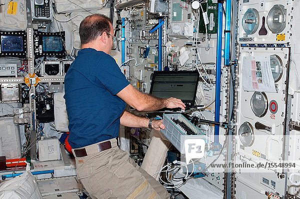 NASA astronaut Rick Mastracchio Expedition 38 flight engineer works with Biolab hardware in the Columbus laboratory of the International Space Station. Biolab is used to perform space biology experiments on microorganisms cells tissue cultures plants and small invertebrates.