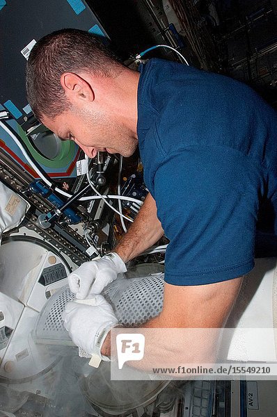 A specimen of human blood or a body fluid like saliva and urine is stowed by astronaut Michael Hopkins onboard the International Space Station on Oct. 5 2013. The objects of post-mission research by scientists on the ground all the various aforementioned biological samples have to be frozen until the return to Earth.