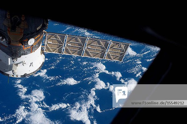 One of the Expedition 37 crew members on Oct. 3 exposed this frame showing a Russian Soyuz vehicle docked to the International Space Station against a backdrop of a blue and white Earth.