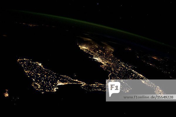 This night image of most of Italy and all of Sicily was photographed by one of the Expedition 37 crew members aboard the International Space Station flying approximately 240 miles above Earth on Oct. 23 2013. The night lights of Rome and Naples are visible near the center of the frame. Many other major cities are also visible by their lights. The Adriatic Sea is on the east (right) side of Italy.