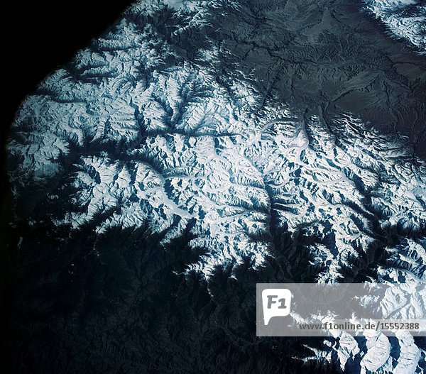 View of the Himalaya Mountain Range in the India-Nepal-Tibet border area as photographed from the Mercury-Atlas 9 capsule by astronaut L. Gordon Cooper Jr. during his 22-orbit MA-9 spaceflight.