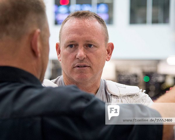 NASA astronaut Barry Wilmore Expedition 41 flight engineer and Expedition 42 commander is pictured during preparations for a spacewalk training session in the waters of the Neutral Buoyancy Laboratory (NBL) near NASA's Johnson Space Center.
