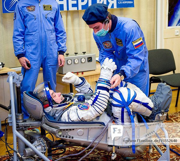 Expedition 38 Soyuz Commander Mikhail Tyurin of Roscosmos is seen laying in a seat liner as he and fellow crew mates Flight Engineer Koichi Wakata of the Japan Aerospace Exploration Agency and Flight Engineer Rick Mastracchio of NASA have their Russian Sokol suits pressure checked a few hours ahead of their launch Nov. 7 2013 in Baikonur Kazakhstan. Tyurin Wakata and Mastracchio will launch in their Soyuz TMA-11M spacecraft to the International Space Station to begin a six-month mission.GCTCIrina Peshkova