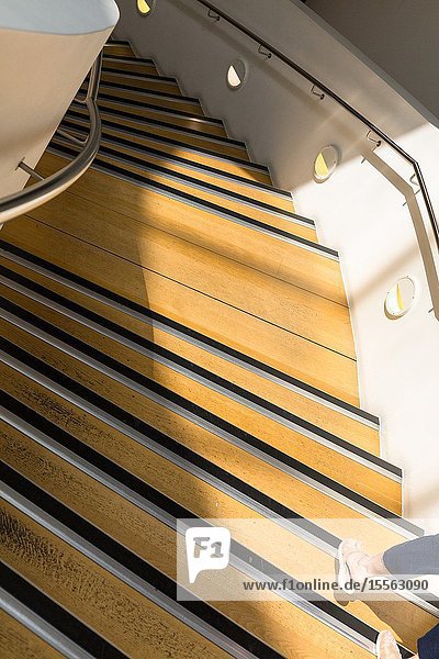 Feet. Interior spiral staircase. Museum of Liverpool. England UK.
