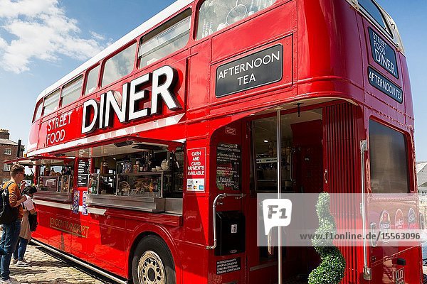 Routemaster bus converted into street cafe diner restaurant facility. Liverpool albert docks. Tourism in Merseyside England UK.