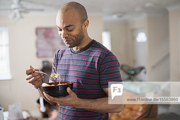 Man eating at home
