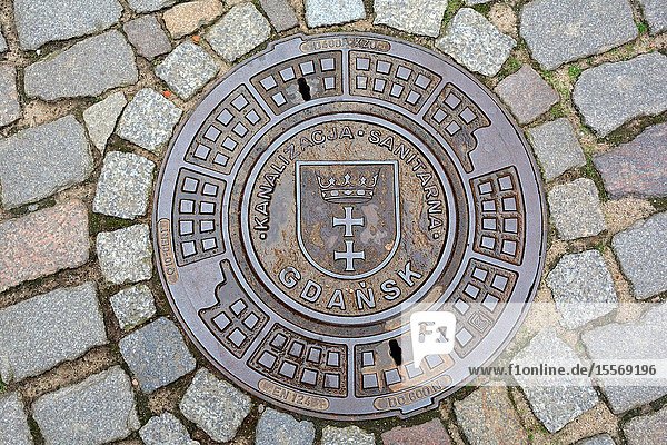 Gdansk, Pomeranian, Poland - June 19, 2019: Man hole cover with the coat of arms of the Polish city Gdansk - Poland.