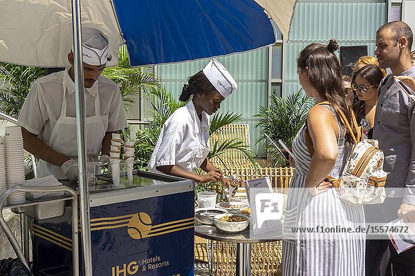Scores of millennials line up at the Intercontinental Hotel Group (IHG) branding event outside the Kimpton Hotel Eventi in New York on Tuesday August 20 2019. IHG is celebrating their collaboration with the U. S. Open by giving out free ice cream from the artisanal ice cream purveyor Morgenstern' s.