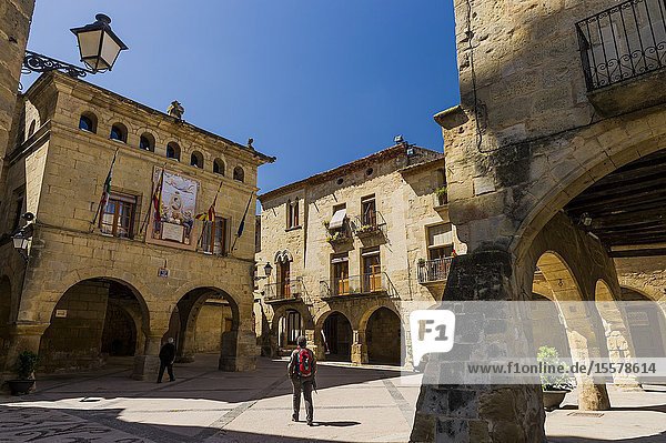 Tourist in Church Square in Horta de Sant Joan town (Tarragona province Catalonia Spain)