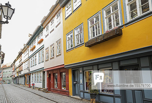 Empty cobble street by residential buildings in Erfurt Germany