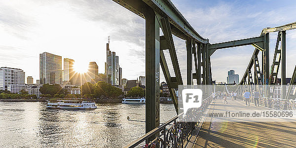 People on Eiserner Steg bridge over river in Frankfurt  Germany
