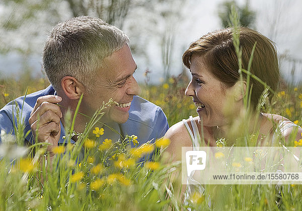 Germany  Munich  Mature couple in garden  smiling