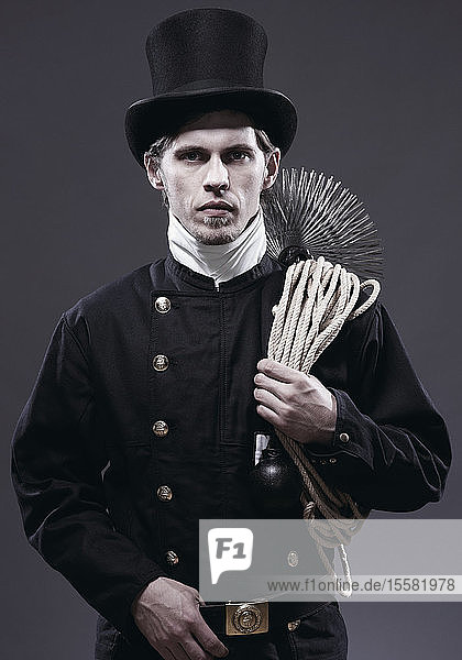 Germany  Chimney sweep with broom  portrait