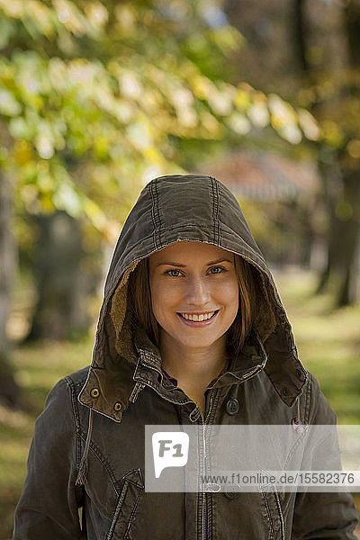 Germany  Rhineland-Palatinate  Female student wearing hood  smiling