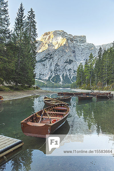 Rowboats moored at Braies lake against mountain  Italy