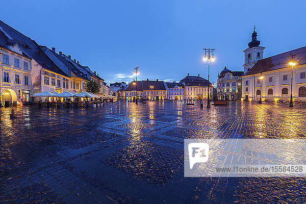 Wet Grand Square at sunset in Sibiu  Romania