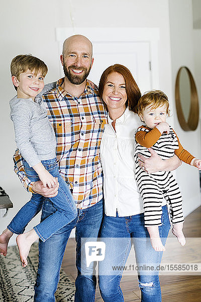 Smiling family in home
