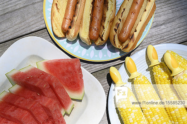 Watermelon  hot dogs and corn cobs