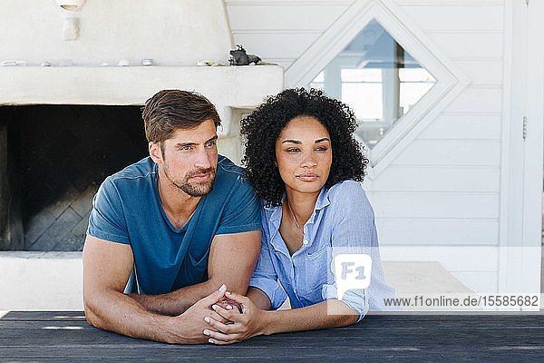 Couple in deep thought in beach house