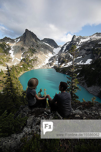 Couple enjoying scenic view  Alpine Blue Lake  Washington  USA