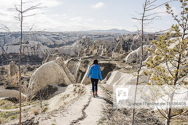 Woman hiking in rocky valley  GÃ¶reme  Cappadocia  Nevsehir  Turkey