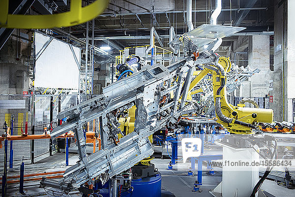 Robots spot welding car parts in car factory