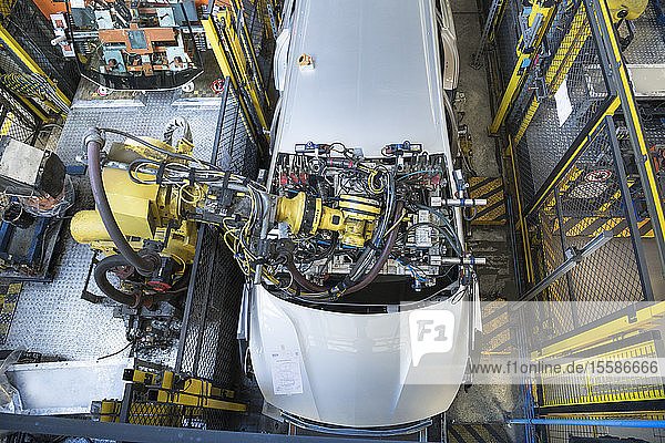 Robot inserting car windscreen in car factory