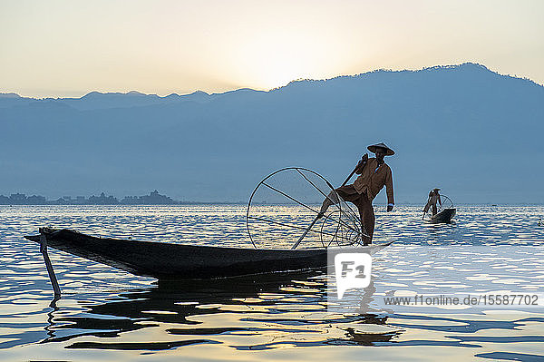 Intha leg rowing fisherman fishing  Inle Lake.  Shan State  Myanmar (Burma)