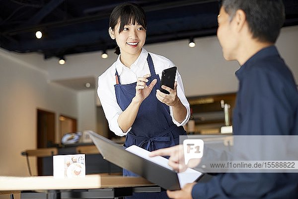 Young Japanese woman working at a restaurant