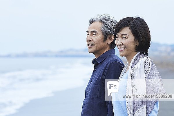 Senior Japanese couple at the beach