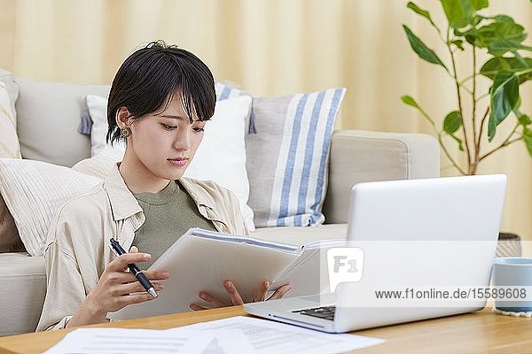 Young Japanese woman working at home