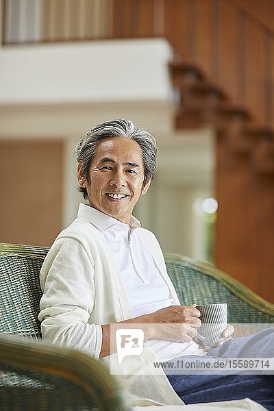 Senior Japanese man at home