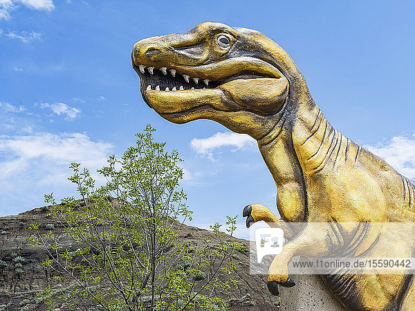 Dinosaur sculpture as part of the 'Welcome to Drumheller' sign; Drumheller Alberta Canada