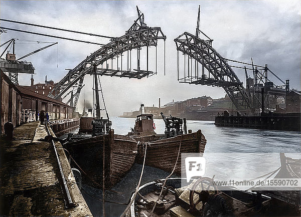 Postcard circa 1900 Victorian/Edwardian  social history. Building Tyne Bridge in 1926  steam ships in foreground; Newcastle Upon Tyne  Tyne and Wear  England
