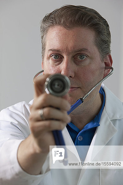 Portrait of a doctor holding a stethoscope