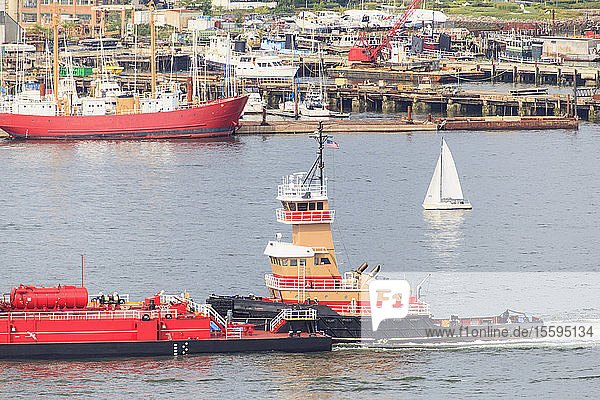 Tugboat moving tanker through Boston Harbor East Boston Boston Massachusetts USA