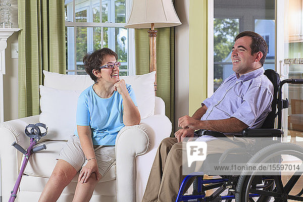 Couple in their home both with Cerebral Palsy