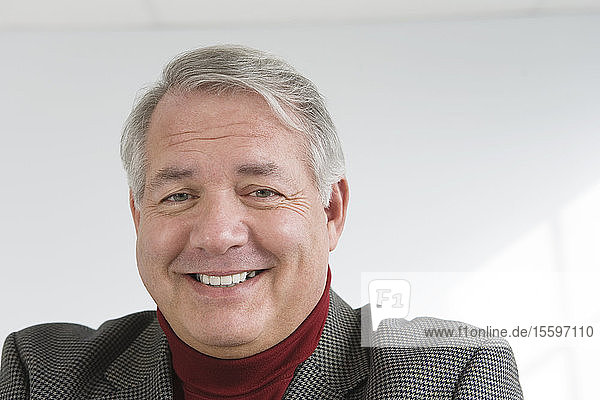 Portrait of a mature man smiling.