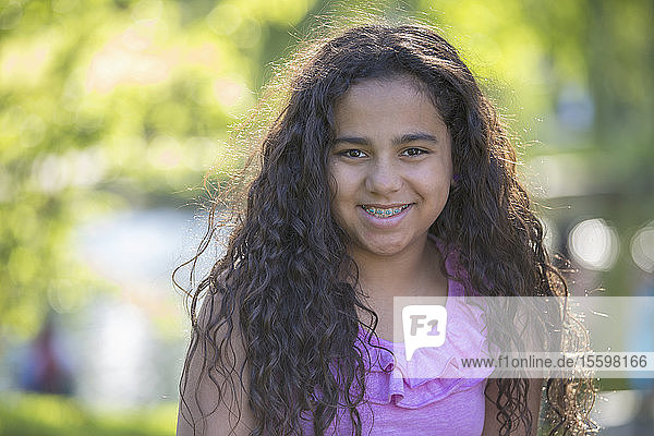 Portrait of happy Hispanic teen girl with braces