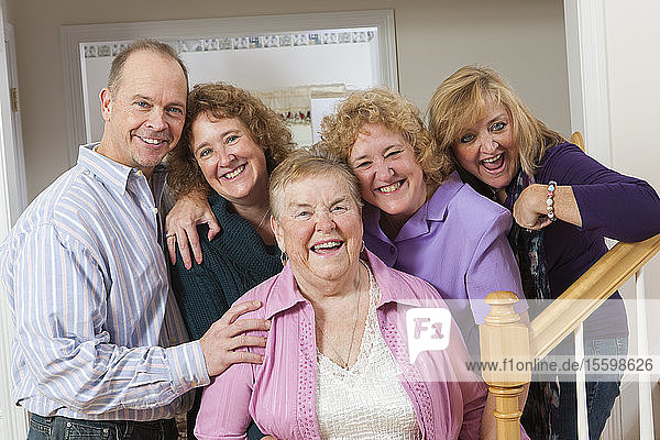 Portrait of a happy elderly mother with her adult children